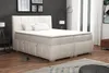 A bedroom scene with a large boxspring bed as the main focus. Produktbild-Vorschau