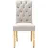 A single beige dining chair with tufted back and wooden legs, presented on a white background. Produktbild-Vorschau