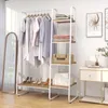 A clothing rack and shelving unit displaying clothes and folded linens. Náhľad obrázku produktu