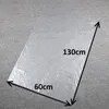 A transparent plastic sheet laid out on a grey surface, with dimensions indicated. Anteprima dell’immagine prodotto