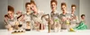 A collage of a woman preparing coffee and drinks, with multiple instances of her in different poses and actions. Anteprima dell’immagine prodotto