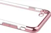 A close-up view of a transparent phone case with rose gold colored edges and buttons. Produktbild-Vorschau