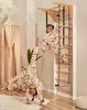 Two young girls are playing on a wooden climbing frame in a child's room. Produktbild-Vorschau