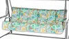 A close-up shot of a floral patterned cushion on a swing. Produktbild-Vorschau