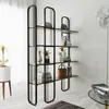 A modern living room with a black metal bookshelf filled with books and decorative items. Podgląd zdjęcia produktu