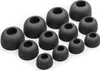 A collection of black silicone ear tips for headphones, arranged in a scattered pattern on a white background. Náhled obrázku produktu
