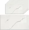 A stack of white marble-look wall panels and one panel shown individually. Produktbild-Vorschau