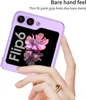 A hand is holding a purple phone case with a flower design on the screen. Náhled obrázku produktu