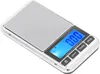 A digital pocket scale with a silver casing and a blue LCD screen displaying '0.00'. Voir les images du produit