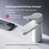 A white faucet is shown next to a smartphone on a sink. Produktbild-Vorschau