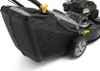 Close-up of a lawnmower's grass catcher and wheel. Produktbild-Vorschau