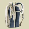 The back view of a beige Deuter backpack with blue mesh padding. Voir les images du produit