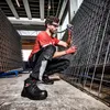 A construction worker in safety gear is working with rebar in a warehouse. Voir les images du produit