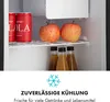 Inside of a mini-refrigerator with cans, apples, and bottles of juice. Produktbild-Vorschau