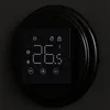 A close-up of a digital thermostat with a black frame and a black screen displaying temperature and icons. Náhled obrázku produktu