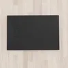 A black shower tray on a light wood floor. Produktbild-Vorschau
