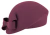 Fiebig schicker asymmetrischer Pillbox-Filzhut mit Schleife in rosa
