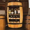 A wooden barrel-shaped wine cabinet filled with bottles of wine and spirits, set against a backdrop of other barrels. Náhľad obrázku produktu