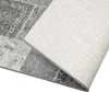 A close-up view of the corner of a rug, showing the top textured surface and the underside. Produktbild-Vorschau