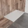 A modern shower tray with a wood-paneled wall and concrete floor. Podgląd zdjęcia produktu