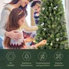 A family decorating a Christmas tree. Podgląd zdjęcia produktu