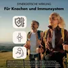 Two people hiking in a natural landscape, with icons and text related to health benefits. Produktbild-Vorschau