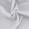A close-up, studio shot of white fabric draped and folded. Náhled obrázku produktu