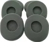 A group of six gray foam ear pads for headphones. Voir les images du produit