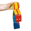 A hand holding a colorful toy snake made of blocks. Náhled obrázku produktu