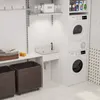 A laundry room with a sink, washing machine, dryer, and storage baskets. Produktbild-Vorschau