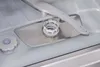 Close-up view of the interior of a dishwasher, showing the filter area and spray arm. Produktbild-Vorschau