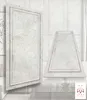 Two decorative wall panels are displayed in a modern living room setting, with a sofa and glass coffee table visible. Produktbild-Vorschau