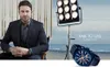 Gerard Butler is seated in a chair, wearing a suit, with a large spotlight and the ocean in the background. A watch is displayed in the foreground. Anteprima dell’immagine prodotto
