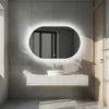 A modern bathroom vanity with a large oval mirror with LED lighting. Produktbild-Vorschau