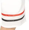 A close-up view of the lower part of a white garment, possibly shorts or a jersey, with two horizontal stripes: one red and one black. Anteprima dell’immagine prodotto