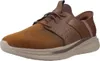 A single brown SKECHERS SLIP-INS SLADE - ZACHARY shoe is shown from a side angle against a white background. Voir les images du produit