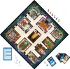 A Cluedo board game laid out on a dark background, with game pieces and cards visible. Podgląd zdjęcia produktu