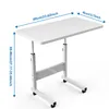 A white adjustable height computer desk with wheels, shown on a white background with dimensions indicated by blue arrows and text. Produktbild-Vorschau