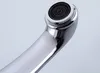 A close-up view of a chrome faucet spout with a black aerator. Podgląd zdjęcia produktu