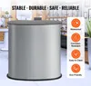 A silver cylindrical tradeshow podium with a gray top, set in a retail or exhibition environment. Icons and text highlight product features. Produktbild-Vorschau