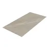 A single rectangular tile with a stone-like texture and cream-colored finish, presented on a white background. Anteprima dell’immagine prodotto