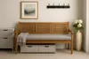 A bench with a cushion and storage drawers underneath, placed in an entryway with a coat rack and artwork on the wall. Produktbild-Vorschau