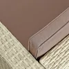 Close-up view of a beige polyrattan lounger with a brown cushion. Produktbild-Vorschau