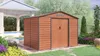 A wooden shed is shown in a garden setting, with a pool and patio area visible in the background. Náhled obrázku produktu
