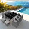 A rattan outdoor furniture set is arranged on a patio next to a swimming pool with a scenic ocean view in the background. Náhled obrázku produktu