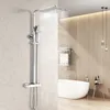 A modern bathroom with a shower system, bathtub, and decorative lighting.