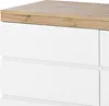 A close-up view of a white dresser with a wood-grain top. Voir les images du produit