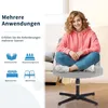 A young woman is sitting on a chair with her legs crossed, smiling at the camera. The image also shows icons representing different rooms where the chair can be used. Produktbild-Vorschau