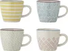 Four ceramic mugs with different patterns are displayed against a white background. Produktbild-Vorschau