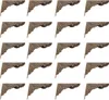 A grid of 16 identical decorative corner protectors for boxes or furniture. Náhled obrázku produktu